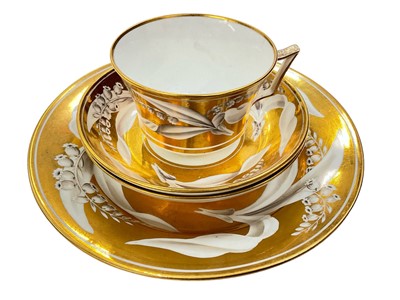 Lot 166 - Wedgwood bone china gold ground Lily of the Valley teacup, two saucers and a plate