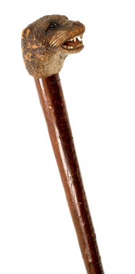 Lot 942 - Rare carved otter pole by Swaine & Adeney, London, the ash tree shaft terminating in a metal spike