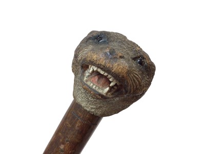 Lot 942 - Rare carved otter pole by Swaine & Adeney, London, the ash tree shaft terminating in a metal spike