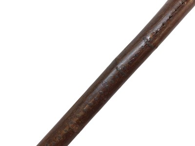 Lot 942 - Rare carved otter pole by Swaine & Adeney, London, the ash tree shaft terminating in a metal spike