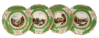 Lot 264 - Set of four 19th century Davenport porcelain dessert plates with finely painted named landscapes on apple green and gilt ground with pierced borders