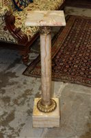 Lot 1450 - Neoclassical-style onyx and gilt metal mounted...