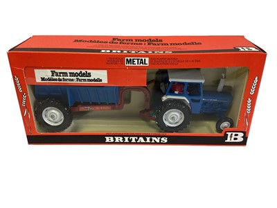 Lot 206 - Britains Ford 6600 blue & white livery Tractor and rear dump trailer No.9630 and Front End Loader No.9574, in window boxes (2)