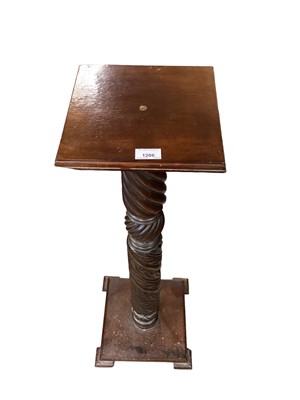 Lot 1206 - Victorian carved mahogany bedpost utilised as a torchere, with sqaure top and base