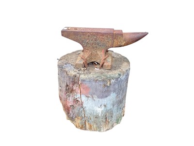 Lot 1298 - Iron anvil on tree stump base