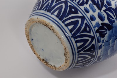 Lot 72 - Large late 19th century Japanese blue and white porcelain vase, moulded and painted in underglaze blue with dragons, shaped rim, 55cm high