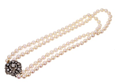 Lot 480 - Cultured pearl two-strand necklace with a Victorian diamond cluster clasp
