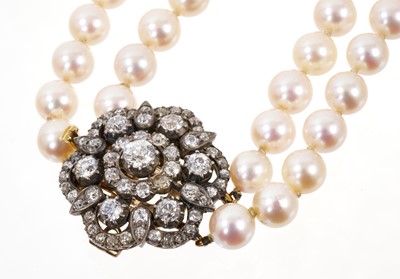 Lot 480 - Cultured pearl two-strand necklace with a Victorian diamond cluster clasp
