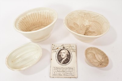Lot 63 - Four jelly moulds and a Wedgwood printed commemorative plaque