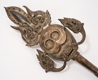 Lot 945 - Antiquei Tibetan ceremonial staff, with stylised skull ornament, 60cm long