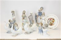 Lot 2154 - Ten Nao porcelain figures - including boy with...