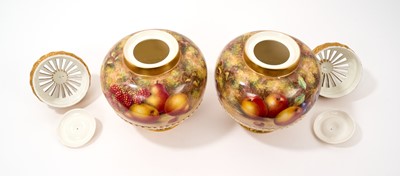 Lot 211 - Pair of Royal Worcester pot pourri vases, covers and inner covers, painted by Freeman