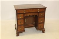 Lot 1482 - George II mahogany kneehole desk with...