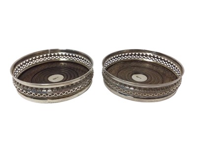 Lot 1106 - Pair of contemporary silver pierced coasters