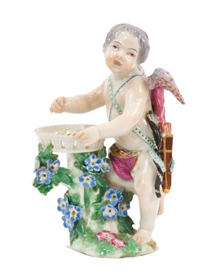 Lot 205 - Chelsea figure of Cupid beside a basket, circa 1760, gold anchor mark