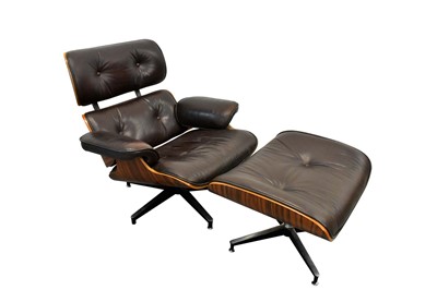 Lot 1433 - Eames style leather and chrome easy chair and stool
