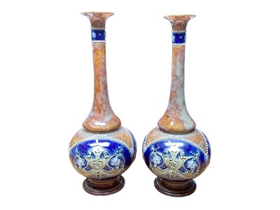 Lot 1141 - Pair of Royal Doulton stoneware bottle vases