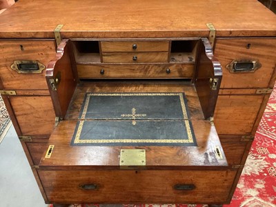 Lot 1409 - Victorian mahogany and brass bound secretaire campaign chest, in two parts