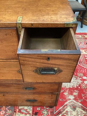 Lot 1409 - Victorian mahogany and brass bound secretaire campaign chest, in two parts