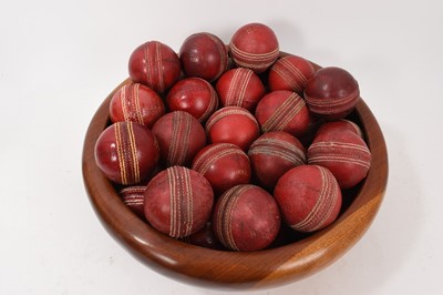 Lot 964 - Wooden bowl housing 35 vintage cricket balls