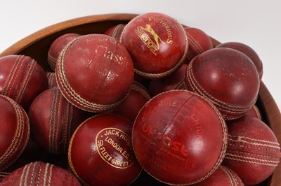 Lot 964 - Wooden bowl housing 35 vintage cricket balls