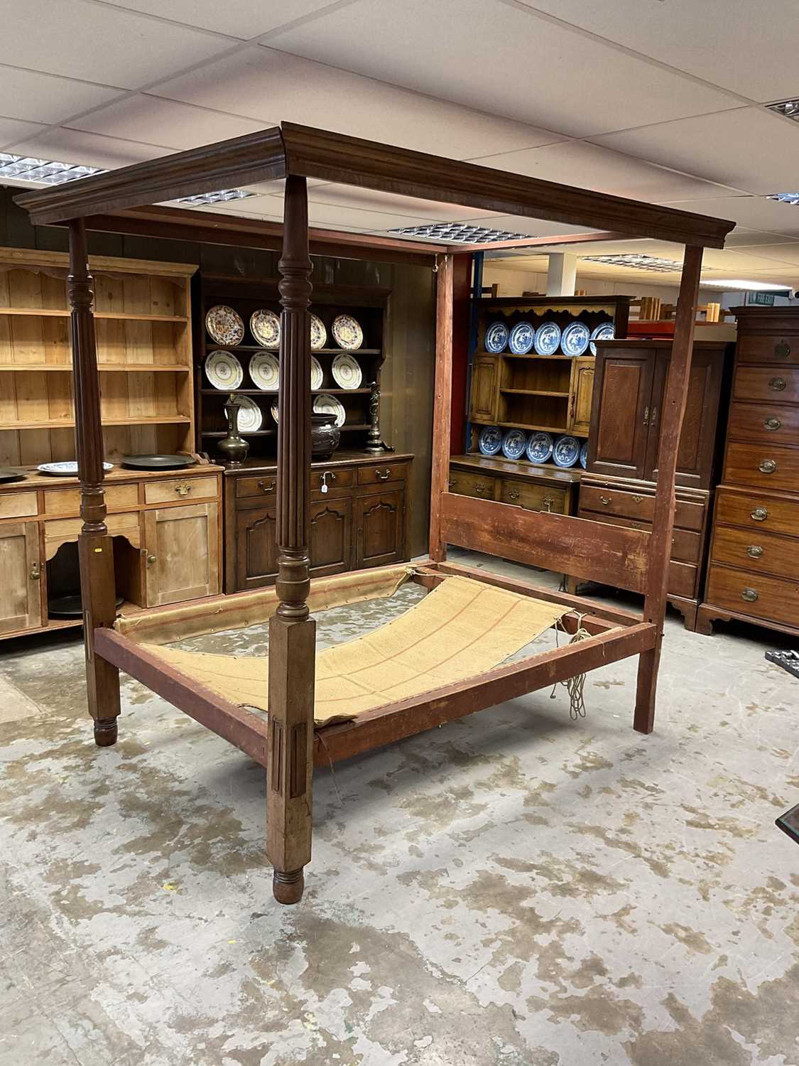 Lot 1287 - 19th century mahogany four poster bed, supported by two front reeded columns, 143cm wide x 212cm high