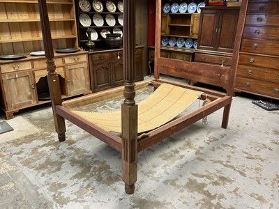 Lot 1287 - 19th century mahogany four poster bed, supported by two front reeded columns, 143cm wide x 212cm high