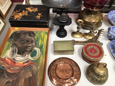 Lot 310 - African oil painting of a tribal woman, old brass oil lamp with cranberry glass shade, Victorian kitchen scales, other metal ware and sundries