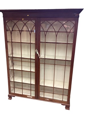 Lot 1412 - Large mahogany display cabinet enclosed by two glazed doors.