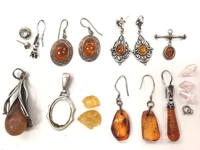 Lot 1070 - Small group of silver and white metal mounted amber earrings and pendants