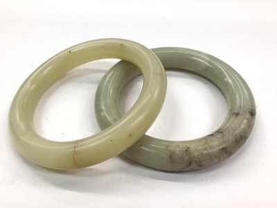 Lot 1071 - Two green Jadeite bangles