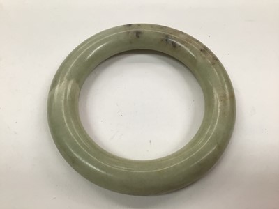 Lot 1071 - Two green Jadeite bangles