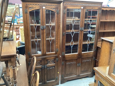 Lot 1302 - Old Charm oak corner cupboard with leaded glazed doors and similar display cabinet, both with linen fold decoration (2)