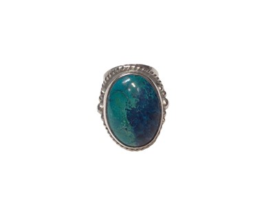Lot 67 - Good quality handmade silver and gem set ring with an oval polished blue/ turquoise cabochon stone and cabochon garnet to reverse