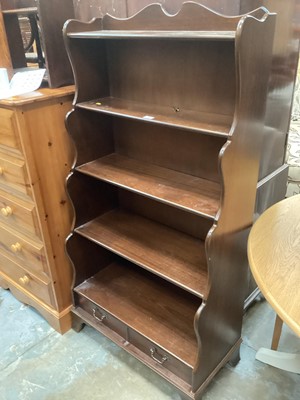 Lot 1322 - Georgian-style mahogany waterfall bookcase with five shelves and two drawers 153cm high, 77cm wide