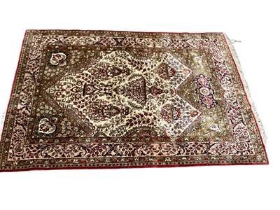 Lot 1368 - Eastern rug with floral decoration on red, cream and green ground, 154cm x 108cm