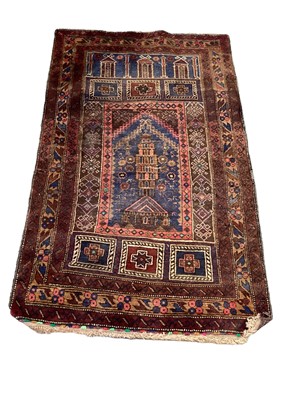 Lot 1372 - Eastern rug decorated with buildings on red, blue and brown ground, 128cm x 80cm