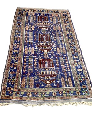 Lot 1373 - Eastern rug with geometric decoration on blue, green and brown ground, 196cm x 111cm