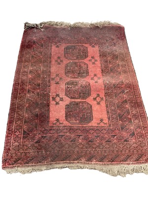 Lot 1375 - Eastern rug with four central medallions on red ground, 135cm x 102cm