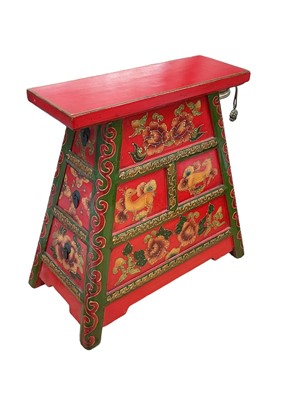 Lot 17 - Tibetan painted stool with three drawers to one side, 44.5cm high