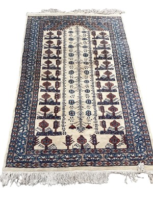 Lot 1378 - Eastern rug with geometric decoration on blue and cream ground, 148cm x 93cm