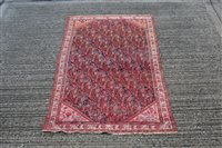 Lot 1549 - Antique Persian rug, the dark brown ground...