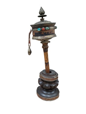Lot 19 - Tibetan prayer wheel and stand, with white metal mounts, total height 44cm