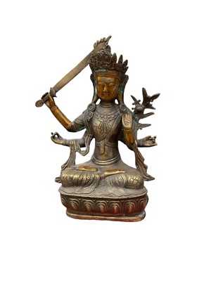 Lot 21 - Tibetan brass Buddha, 28.5cm high