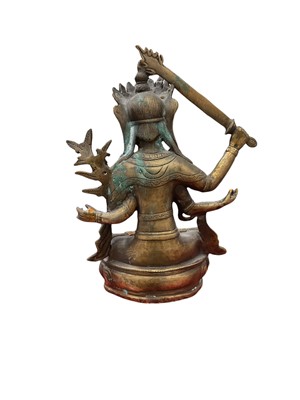 Lot 21 - Tibetan brass Buddha, 28.5cm high