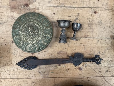 Lot 24 - Group of Tibetan items, including two white metal wine cups, a brass relief decorated box and a Phurba (4)