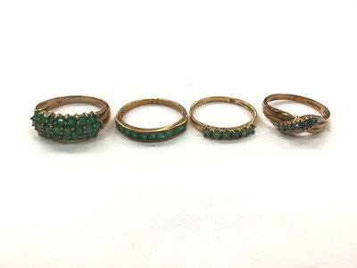 Lot 1041 - Four 9ct gold emerald/ green stone dress rings