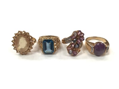 Lot 1042 - Four 9ct gold multi-gem set cocktail rings