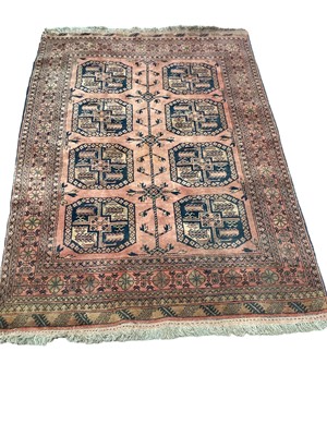 Lot 1394 - Eastern rug with eight medallions on red ground, 190cm x 135cm