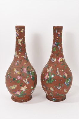 Lot 247 - Large pair of Watcombe style terracotta bottle vases with enamelled decoration